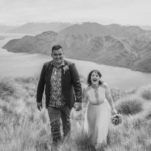 Couple laughing at mountain top ceremony Wanaka